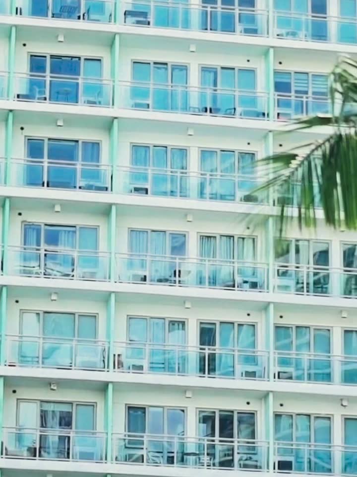 White oceanfront resort with balconies